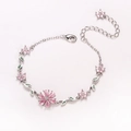 Elegant silver cherry blossom bracelet with pink crystal flowers and green leaf charms - Platinum - Double Prong