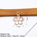 Macro detail of a 1.4cm pink enamel cherry blossom charm with pearl inlay and alloy base - Pink (Pearl)