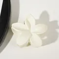 Macro view of matte white plumeria flower hair claw clip with elegant petal details - Matte Cream White