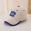 Detailed view of Stay Cool embroidery on cotton baby baseball cap with blue trim - 48-52cm (2-6 Years) / Beige