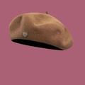 Close-up of wool beret texture with vintage metal logo badge and Since 1989 engraving - M / Khaki