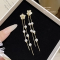 Elegant gold flower tassel earrings with white pearls and crystals on black velvet - Gold Pearl Flower Tassel (E0058)