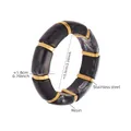 Detail showing marble resin segments and golden stainless steel links with size specs - 55mm / Black (E678)