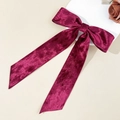 Macro shot of burgundy velvet bow hair clip with long ribbons and soft fabric texture - Long Ribbon Bow / Burgundy