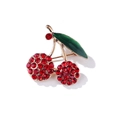 Elegante broche de cereza con cristales rojos y hoja de esmalte verde en base dorada - Cereza Roja