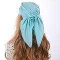 Close-up of light blue satin square scarf tied as a bow with smooth silky texture - 70cm x 70cm / Sky Blue