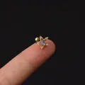 Star-shaped gold ear stud with opal center and zircon accents held on fingertip - Star Design (347-6#G)