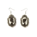 Gothic Halloween earrings featuring black silhouette skeleton couple in vintage frames - White
