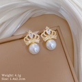 Detail shot of golden crown earrings with white pearls and zircons on silk background - Crown Pearl Stud Earrings (D350) / Gold Earrings