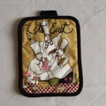 Thick cotton pot holder with yellow chef print, black trim, and Let's Eat text - Baker
