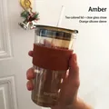 Amber glass breakfast cup with orange silicone sleeve and straw, elegant design - Amber + Tea Lid + Clear Glass Straw + Orange Silicone Sleeve