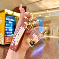 Detail of creative bubble tea bear keychain with liquid sand and pink bear inside - Milk Tea Bear Cup