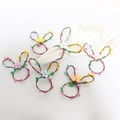 Detail of bunny napkin rings with colorful floral accents for Easter party tables - Rabbit Head Napkin Ring (Mixed Flower Colors)