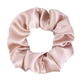 Detailed view of champagne satin scrunchie with soft silk texture and elegant pleats - Champagne