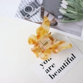 Elegant amber leopard pattern butterfly hair claw clip for girls on minimalist white background - Coffee