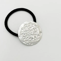Elastic black hair tie featuring a polished silver alloy round wavy textured bead - Matte Silver - Linear Round