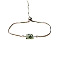 Adjustable silver bolo bracelet featuring a rectangular green phantom quartz gemstone - Prehnite