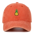 Close-up of embroidered pineapple on vintage washed orange cotton baseball cap - Orange