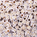 Macro shot of white acrylic cube beads with gold star heart and moon patterns for DIY jewelry - 6x6mm Gold Star Moon (100pcs)