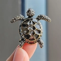 Exquisite turtle brooch in black and gold alloy with sparkling white rhinestones - Black