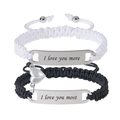 Close-up of magnetic heart pendants and engraved stainless steel plates on braided bracelets - I Love You More & I Love You Most