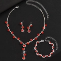 Set elegante di collana, bracciale e orecchini con strass rossi vivaci e finitura argento - Set Strass Rosso