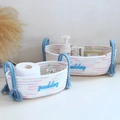 Detail of woven cotton baskets with blue goodday embroidery and tassel handles - Colorful - Blue Handle