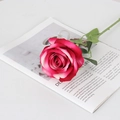 Artificial velvet rose in deep pink gradient with green stem on a magazine background - Large Velvet Deep Pink