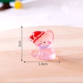 Miniature pink resin Christmas cat figurine with Santa hat and glowing crystal texture - Pink