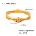 Detail of wavy stainless steel ring with faceted rose quartz stone inlay and dimensions - US 6 / Gold