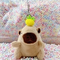 Brown capybara plush keychain featuring a yellow pineapple accessory and metal clasp - Light Brown Pineapple + Silver Clip
