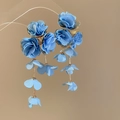 Detail of blue chiffon flower tassel earrings with golden metal links and petals - Blue