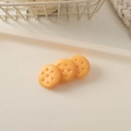 Detailed view of three resin biscuit-shaped hair charms on a cream decorative tray - Plain Biscuit-Round