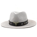 Detailed macro view of woven straw fedora hat featuring a bull head badge and star rivets - Grey (Bull Head Leather Band Style)
