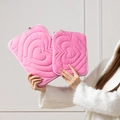 Detail view of quilted heart pattern laptop sleeve set held by a person in a white top - 11" / Pink