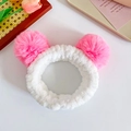 Soft white plush headband featuring two large pink fuzzy pom poms for women - Pink