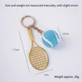 Mini tennis racket keychain with blue felt ball and gold finish, size 7.7cm by 3cm - 2.5cm Large Blue Tennis Ball + Gold Racket