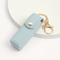 Light blue faux leather lipstick case keychain with gold metal clasp and snap closure - Blue