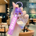Purple shell keychain featuring liquid sand, a sea snail pendant, and a speed wrist strap - Purple (Strap Style)
