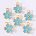 Detail of blue cherry blossom pendants with gold edges and central sparkling crystals - Blue