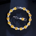 Detailed view of yellow square cut gemstone bracelet with silver base and extra clasp - Yellow