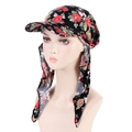 Detail of floral headscarf hat with sun brim and long straps on a mannequin head - Black Red Flower