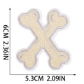 Detailed view of bone-shaped Halloween embroidery patch with size measurements in inches - Letter X