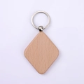 Minimalist diamond-shaped wooden keychain with natural grain and silver metal ring - Beech Rhombus