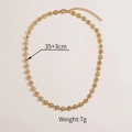 Detail of gold chain necklace with colorful beads showing 35+3cm length and 7g weight - Sun Necklace