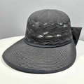 Foldable black woven straw sun hat for women featuring a large back bow and hollow knit - One Size / Black