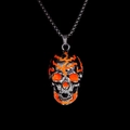 Close-up of hip hop skull pendant with orange flame pattern on black finish - Orange Light