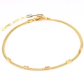 Dettaglio della catena a serpente placcata oro 18k con quattro zirconi champagne - Zirconia Champagne