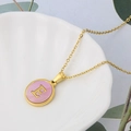 Golden stainless steel necklace with pink shell round pendant featuring letter E - Pink-E