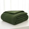 Nordic style dark green chunky knit blanket with tassels folded on a white surface - Army Green